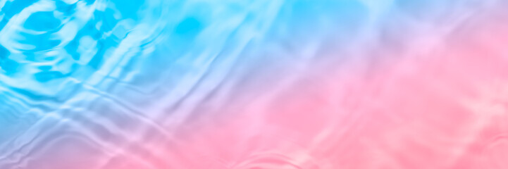 Serum or water texture close up. Light blue and pink gradient liquid gel background. Transparent...