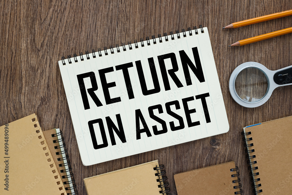 Poster business acronym roa - return on assets. open notepad with text near many notepads and magnifier