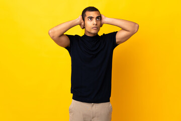 African American man over isolated background frustrated and covering ears