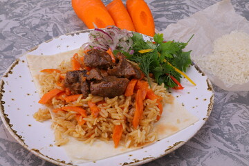 pilaf is a national dish of meat and rice with vegetables cooked over a fire in a cauldron very tasty and healthy from natural products