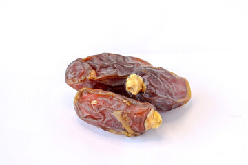 Heap of dates, Pile of tasty dry dates isolated on white background. Arabic food.