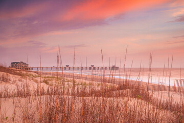 Sunrise over the beach and a fishing pier along the Outer Banks in North Carolina near Nags Head