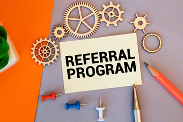 Notebook with Toolls and Notes about Referral Program