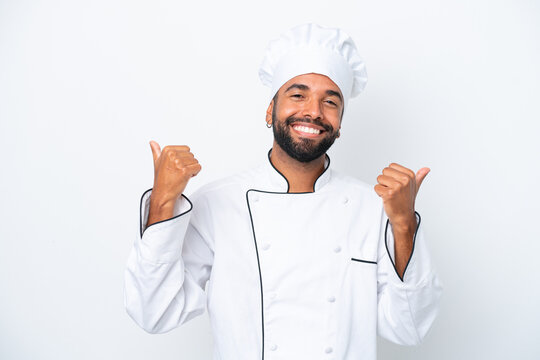Young Brazilian chef man isolated on white background with thumbs up gesture and smiling