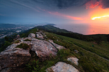 Sunset at the sea seen from the top of Jaizkibel mountain at the basque coast.