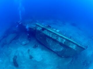 wreck underwater shipwreck on seabed sea floor standing metal on ocean floor scuba divers to see