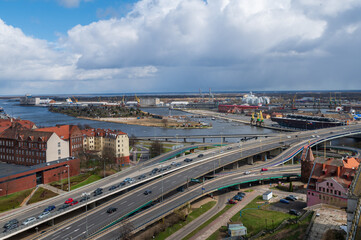 Obraz premium High angle view at overpass crossing Odra river in Szczecin town. Poland. City is divided by river into left and right city parts.
