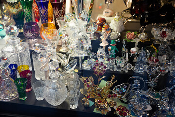 Variety of glassware and souvenirs from famous Bohemian crystal on showcase of boutique..