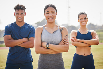 Were confident that well come out on top. Cropped portrait of three young athletes standing outside with their arms folded.