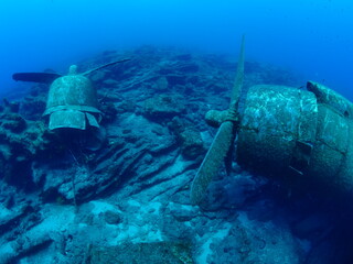 Naklejka na ściany i meble airplane wreck c47 dakota aircraft underwater propeller airplane engine metal on ocean floor scuba divers to explore