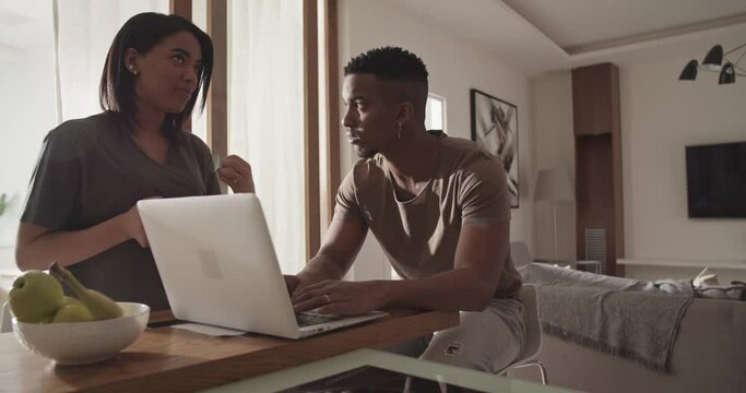 Diverse couple talking in morning