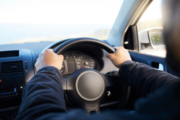 You know more of a road by having traveled. Shot of a unrecognizable man driving his car.