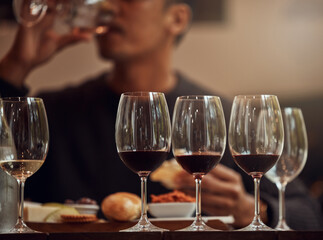 My palate is experiencing a plethora of flavors and aromas. Shot of a man enjoying a cheese platter and tasting different wines.