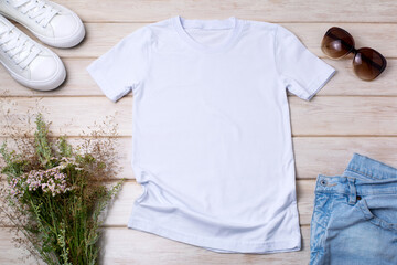 Womens white T-shirt mockup with wild grass and flowers - obrazy, fototapety, plakaty