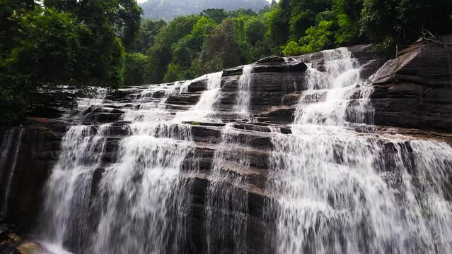 Waterfall in the rainforest, jungle. Aerial drone of Olu Ella Falls, Sri Lanka