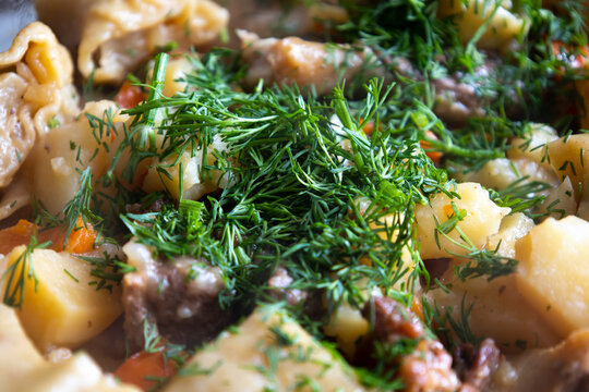 Stewed potatoes with meat and herbs.