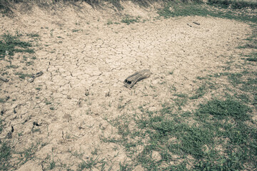 Landscape ground cracks drought crisis environment background.