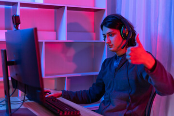 Men play E-Sport games or streamers, Thumbs up or like, Male enjoying playing online games,...