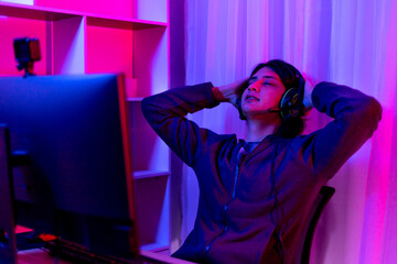 Men play E-Sport games or streamers, Lost the match, Male stressed after being criticized and scolded by the audience, Technology game trends, Hurt the feelings, sadly.., Red and blue background...