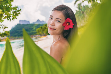 Spa wellness beauty portrait at beach. Serene multiracial woman outdoors at tropical luxury resort....