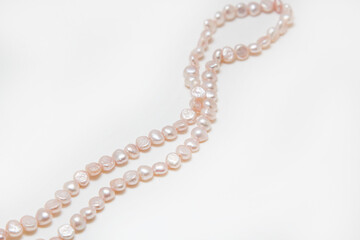 Pearl beads on a white background