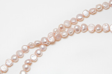 Pearl beads on a white background