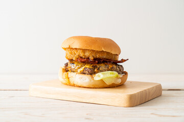 beef burger with cheese, bacon and onion rings
