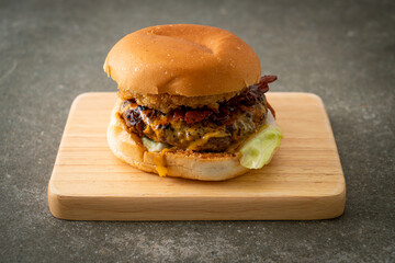 beef burger with cheese, bacon and onion rings