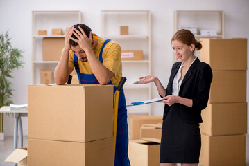 Young female boss and male contractor doing home relocation