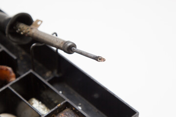 Old soldering iron on a white background