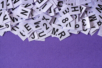 Numbers and letters on a purple background with purple background copy space as an idea for...