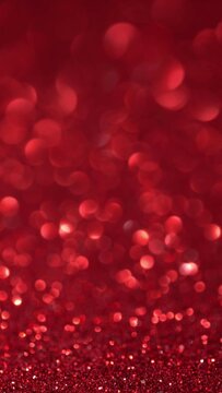 Shiny Red Surface Rotates. Magic Bokeh Background