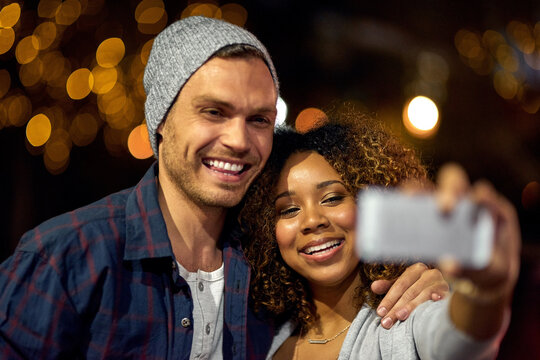 Well Always Remember This Night. Cropped Shot Of A Young Couple Out On A Date In The City.