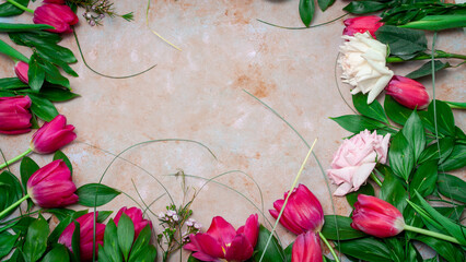 Row of red tulips on wooden background with space for message. Mother's Day background. Top view