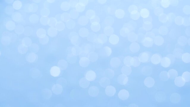 Bokeh blue christmas holiday abstract background, blurred motion of white lights