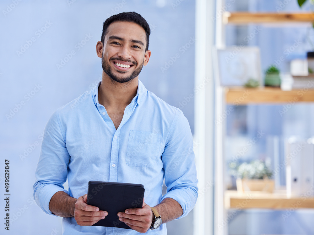 Canvas Prints I recommend everyone use a digital tablet. Shot of a young businessman using a digital tablet at work.