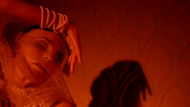 alluring arabian concubine is dancing in harem in night, seduction and temptation, closeup of face