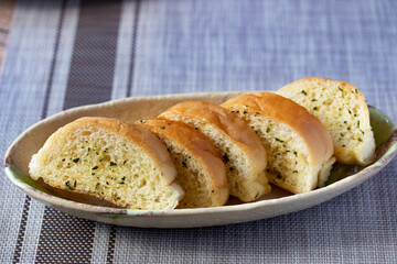 Fototapeta premium Slices of toasted bread with garlic and herbs