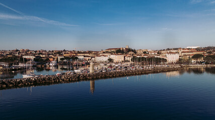 Fototapeta premium Aerial view of a lake town on a beautiful quiet morning 