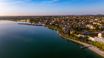 Fototapeta premium Aerial view of a lake town on a beautiful quiet morning 