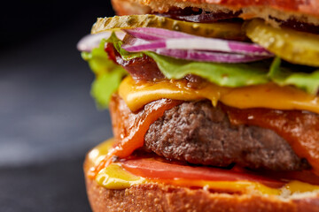 tasty burger with beef cutlet and vegetables