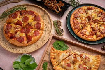 Top view of hot Mushroom and Sausage Pizza on wooden background.