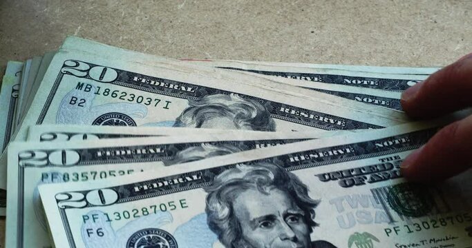 Andrew Jackson in 20 dollar bills USDs spread out  4k