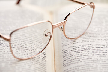 glasses on the book pages