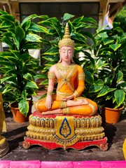 Buddha image in meditation posture, beautiful royal robes