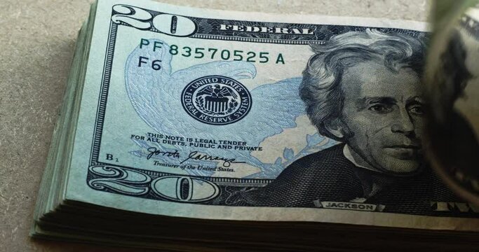 Andrew Jackson in 20 dollar bills USDs flipping into frame  4k