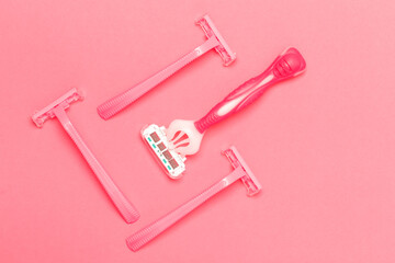 Hygiene Concepts. Closeup Image of Various Female Pink Disposable Razors Shavers Placed Bulk Over Trendy Pink Coral Background