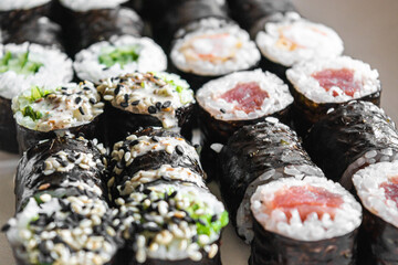 Sushi set close-up on black background. Traditional Japanese seafood. Delicious roll. Advert for food delivery service. 