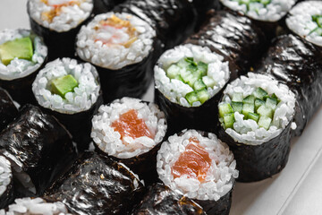 Set of sushi and maki on white background. Flat lay, top view