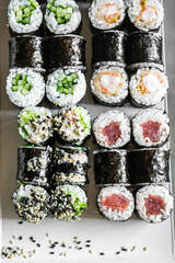 Set of sushi and maki roll on dark background .Top view